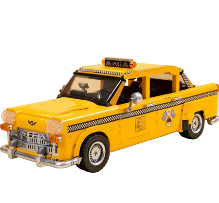 Yellow taxi model car on a beige background