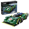 Green racing car model with detailed design, featuring a visible brand logo on the box.